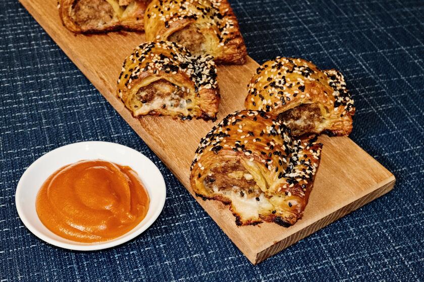 Curtis Stone prepares tomato sauce and sausage rolls - an Australian specialty and a childhood favorite - in the L.A. Times Test Kitchen.