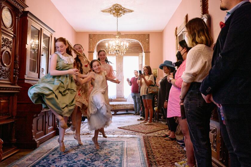 Four young ballerinas perform before guests at the immersive 'Little Women Ballet' inside L.A.'s Heritage Square Museum