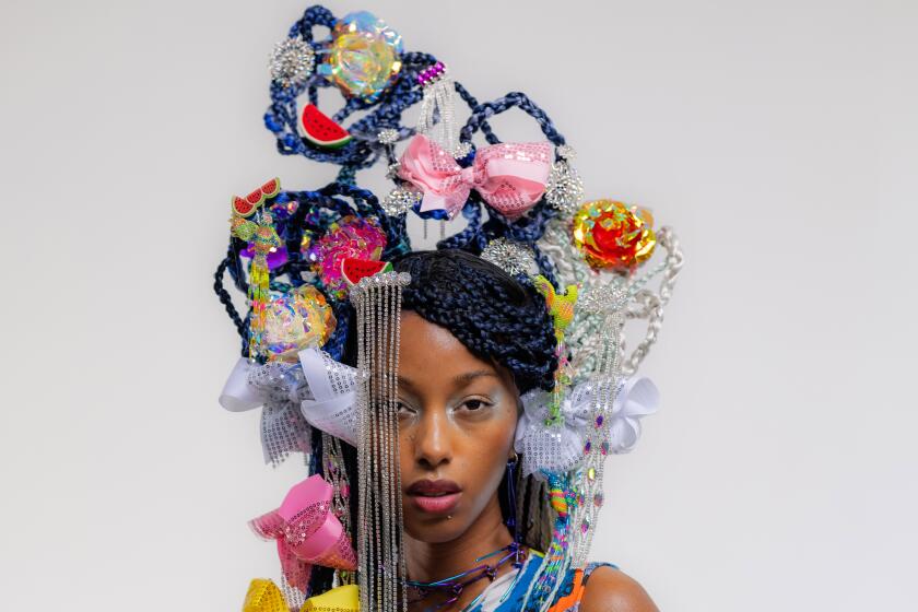 Model Sydney Nelson poses with an original hair piece