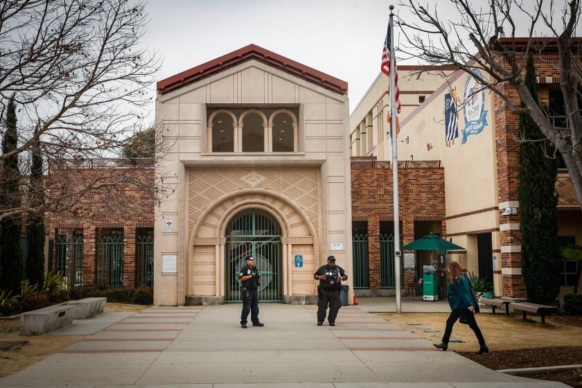 Beverly Hills, CA - February 26: Security guards stand outside at Beverly Vista Middle School on Monday, Feb. 26, 2024 in Beverly Hills, CA. (Jason Armond / Los Angeles Times)