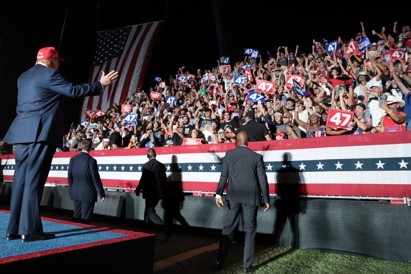 Coachella, California October 12, 2024-Presidential candidate Donald Trump waves to the crowd after his speech during a rally at Calhoun Ranch in Coachella Saturday.(Wally Skalij/Los Angeles Times)