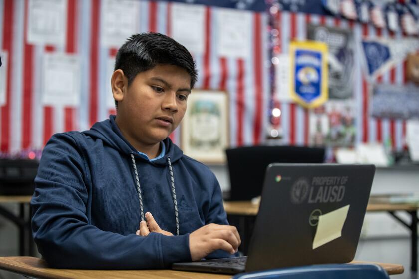 Los Angeles, CA - April 04: After losing three days of instruction from the LAUSD strike, 7th-grader Dylan Camacho, 13, 7th studies in 7th/8th grade English and Social Studies class as he joins fellow students participating in "acceleration days," which are intended as an opportunity for needed but optional extended learning for all students in the nation's second-largest school system at Griffith STEAM Magnet Middle School in Los Angeles Tuesday, April 4, 2023. (Allen J. Schaben / Los Angeles Times)