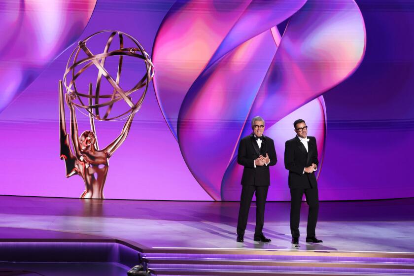 LOS ANGELES, CA - September 15, 2024 - Eugene Levy and Dan Levy during the 76th Primetime Emmy Awards at the Peacock Theater on Sunday, September 15, 2024 (Robert Gauthier / Los Angeles Times)