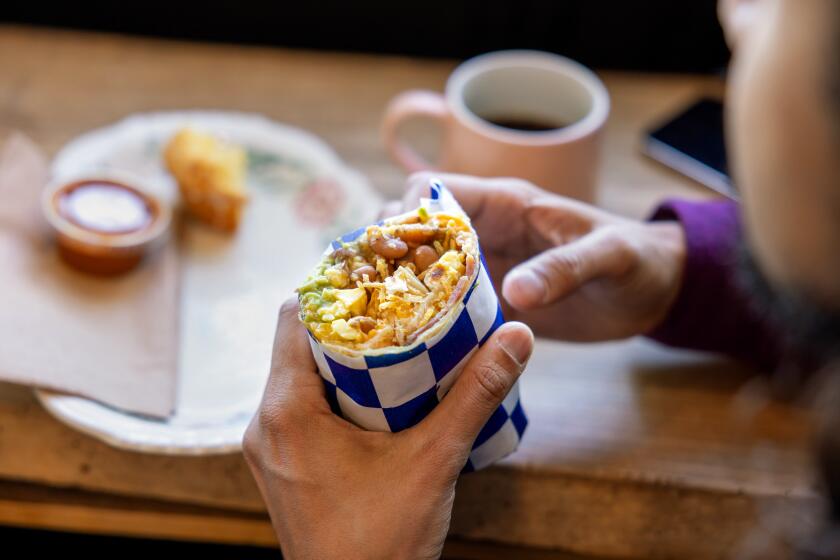 LOS ANGELES, CA - JANUARY 13, 2024: The breakfast burrito, a popolar item at the Guerrilla Cafecito in the Arts District neighborhood in downtown Loa Angeles on Saturday, Jan. 13, 2024. (Silvia Razgova / For The Times)