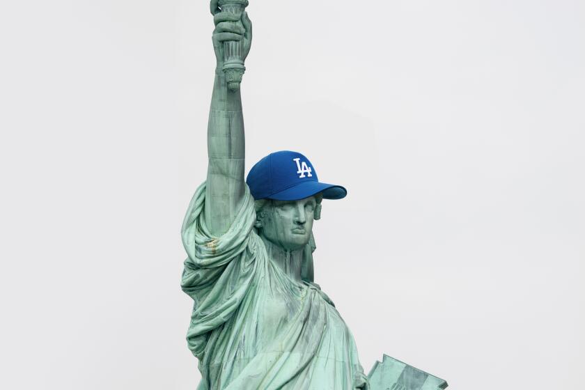 photo illustration of the Statue of Liberty wearing a blue L.A. Dodgers baseball cap