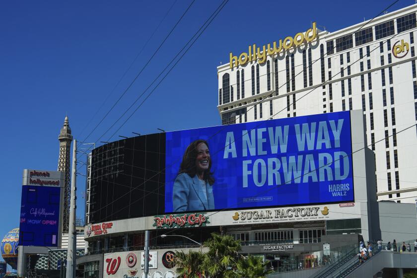 A billboard displays an advertisement for Democratic presidential nominee Vice President Kamala Harris on the Las Vegas Strip, Friday, Aug. 23, 2024. (AP Photo/Julia Nikhinson)