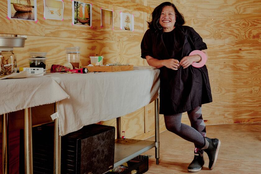 LOS ANGELES, CA - SEPTEMBER 26: Artist in Residency, Minh Phan, shows early food waste experiments and art installation concepts inside of her trailer studio at The Food Forward Pit Stop on September 26, 2024 in Los Angeles, CA. (Shelby Moore / For The Times)