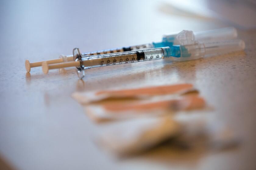 Syringes with the Pfizer vaccine against COVID-19.