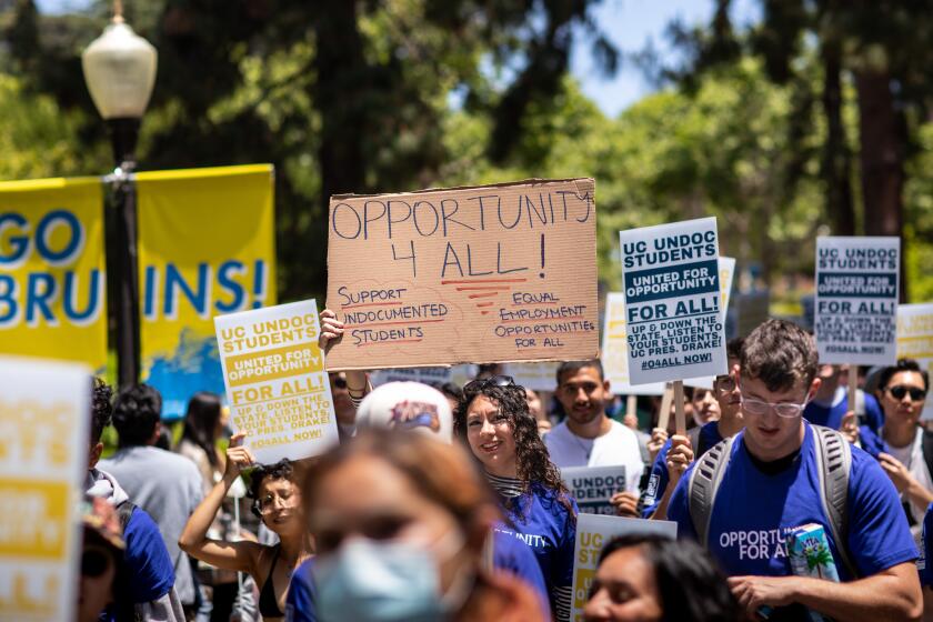 Los Angeles, CA - May 17: Students and supporters gathered to support undocumented students in the University of California system, rallying and marching to protest outside a meeting of the UC Board of Regents meeting, on the UCLA Campus in Los Angeles, CA, Wednesday, May 17, 2023. The rally wants to demand the UC Board of Regents break legal ground and authorize the hiring of students who were brought to this country illegally as children and lack valid work permits. (Jay L. Clendenin / Los Angeles Times)